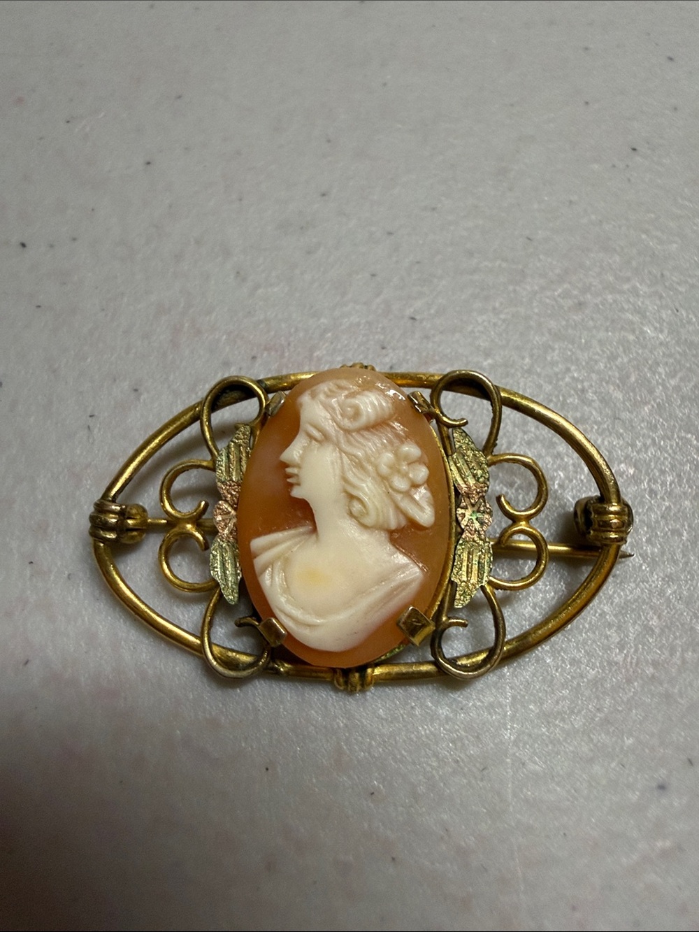 Source Unknown Peach and Gold Carved Cameo Brooch